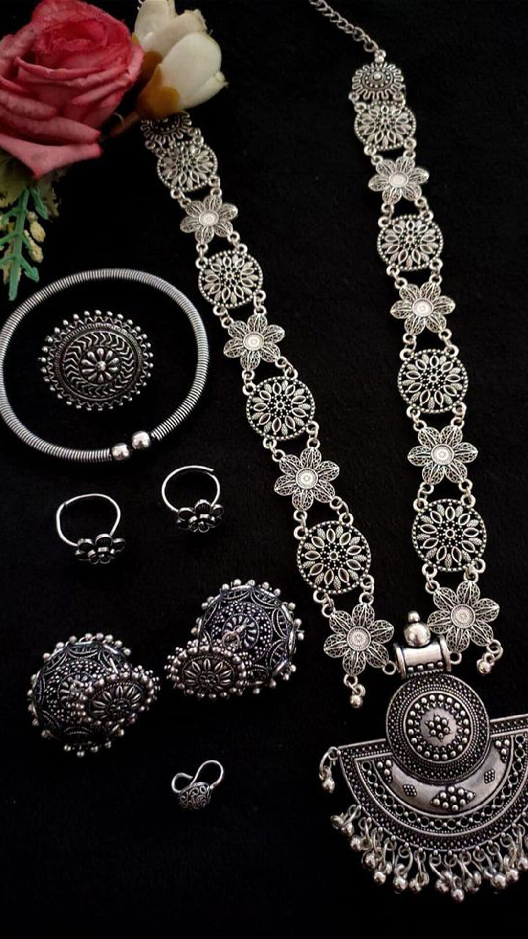 An silver Oxidised necklace and matching earings and rings for wedding